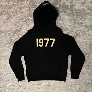 Essentials Black Hoodie with Cream '1977' Design
